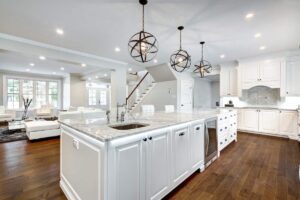 Buyer and seller reviewing a luxury home purchase offer at a table with inspection documents and property plans.